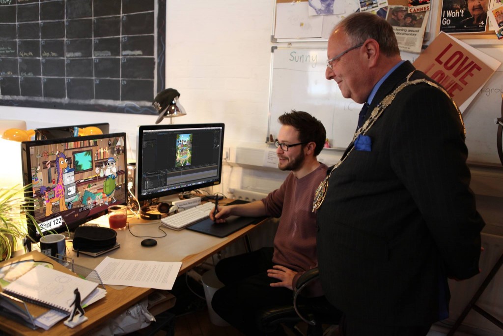 LoveLove lead animator Sunny Clarke showing the Mayor of Bournemouth our latest project, Bottle Island