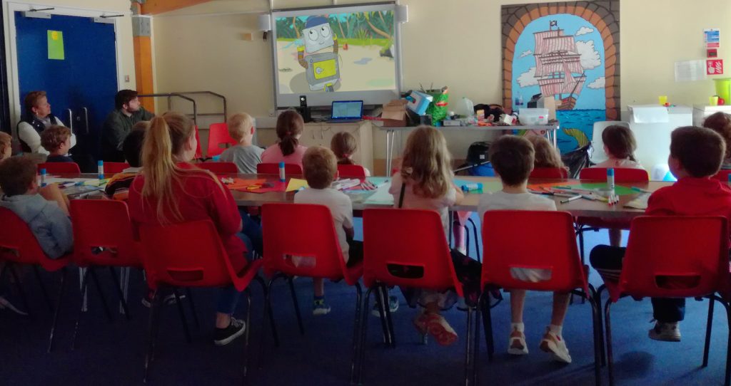 Children watching the Bottle Island Pilot Episode 'Crab City'